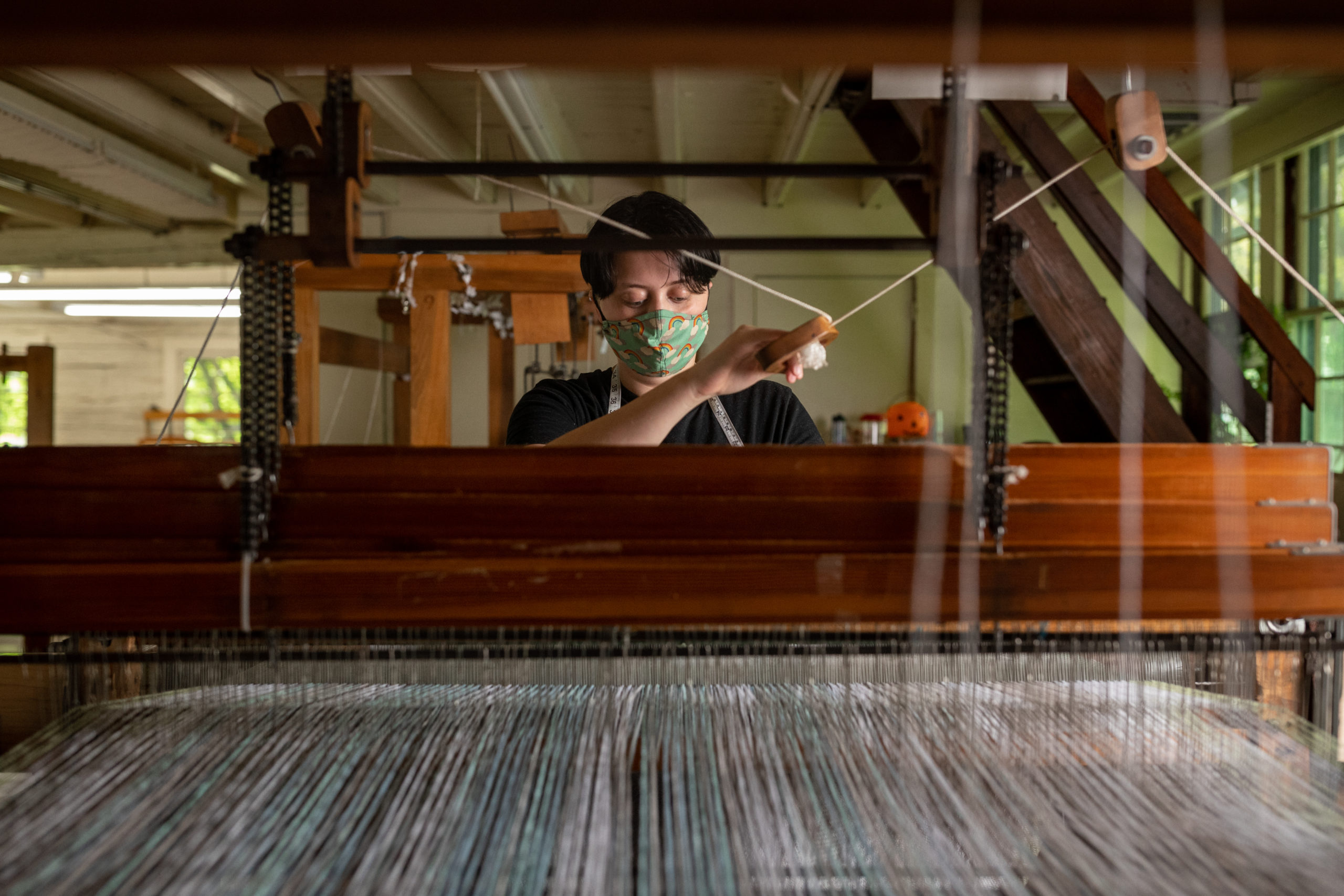Emerson Croft at a weaving loom