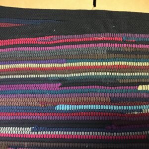 Rug black, dark earthy tones